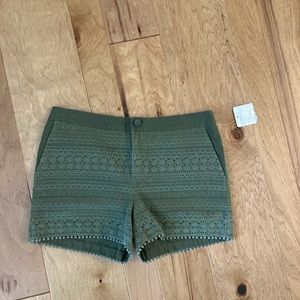 Anthropologie Army green lace overlay shorts